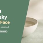 Dry flaky skin on face: a pale bowl of warm water and a washcloth on a sage stone surface